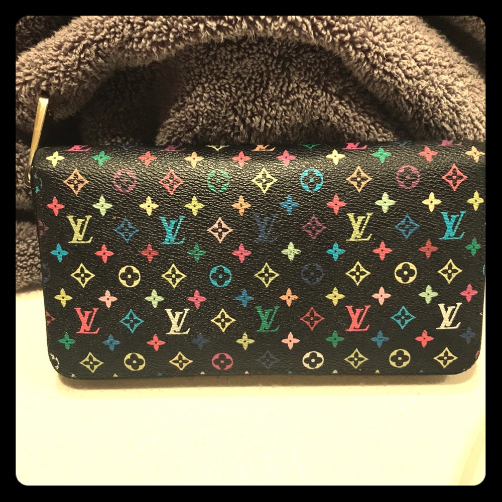 A multi color Zippy Louis Vuitton wallet Nior.